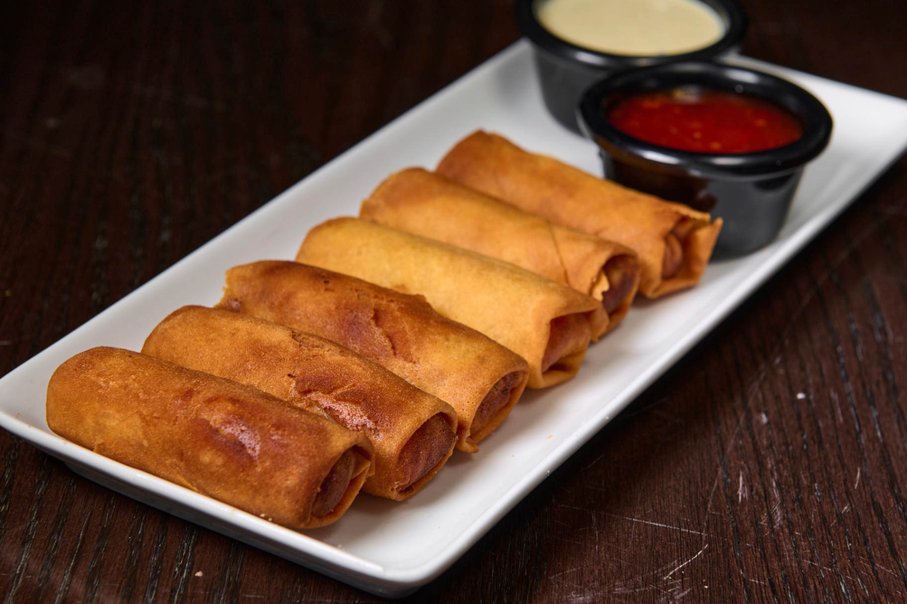 Crispy vegan spring rolls appetizer served at Platinum Mic karaoke lounge in Brooklyn NYC